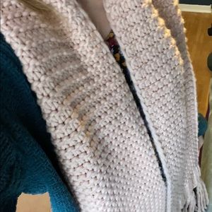 Pink knit fringe scarf